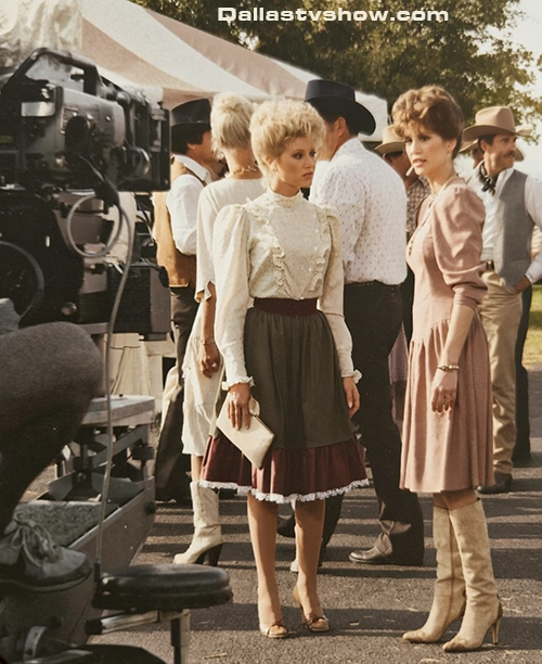 Victoria Principal and Audrey Landers filming in strong wind with upswept hair